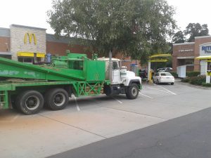 Canterra Combo Rig utilizing air rotary to install a groundwater monitor well in a McDonalds drive thru lane